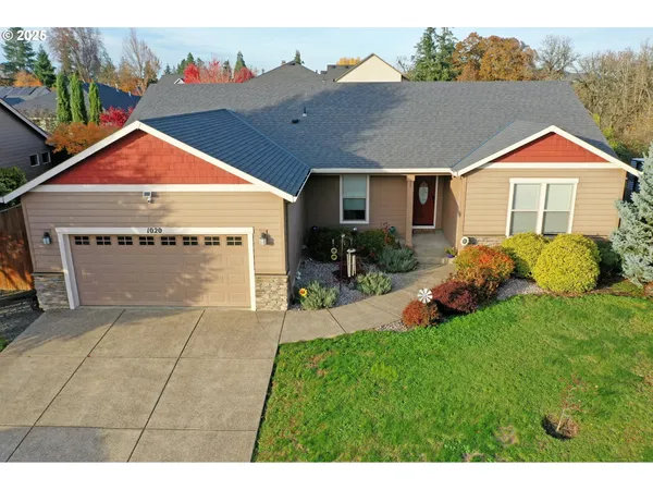 a view of front of house with a yard