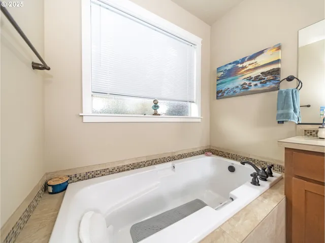 a bathroom with a tub and a sink