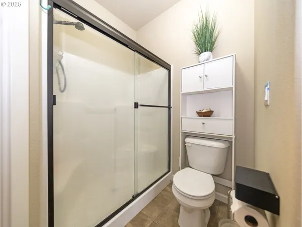a white toilet sitting next to a bathroom sink