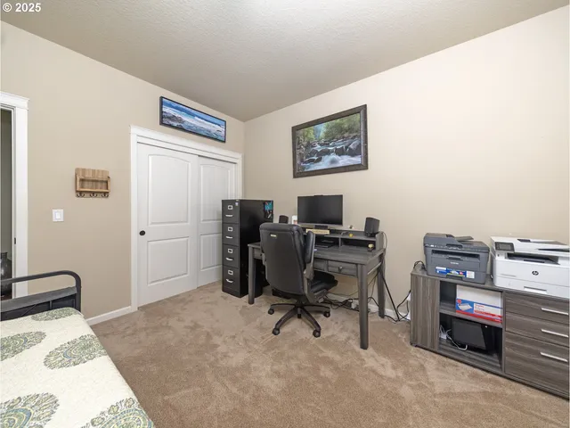 a view of a workspace with furniture