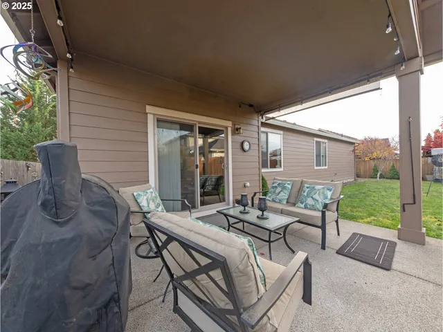 a outdoor space with patio the couches and a dining table with garden view