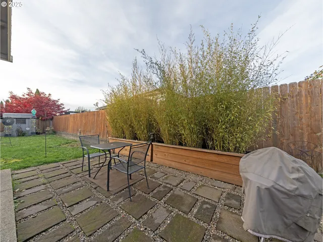 a view of a backyard with sitting area