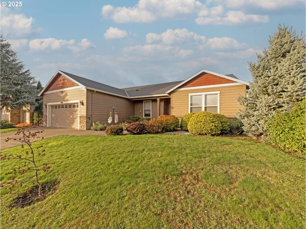 a front view of a house with a yard