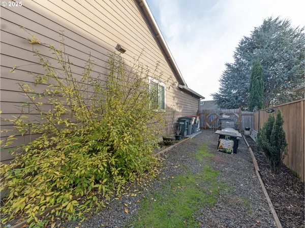 a view of a backyard with sitting area