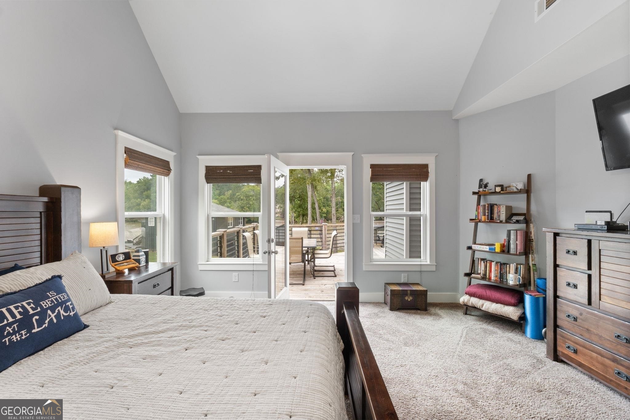 660 Doe Lane Mansfield, GA 30055 - Photo 11 of 45 a bedroom with furniture and a large window