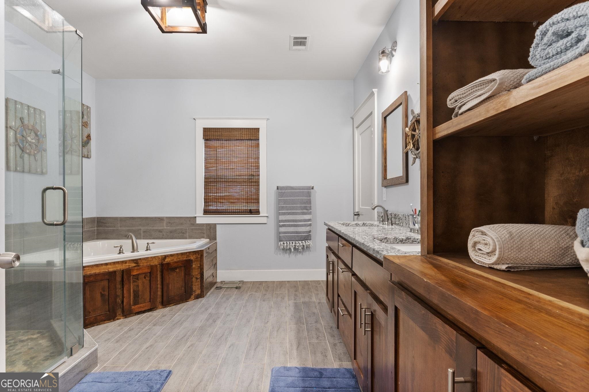660 Doe Lane Mansfield, GA 30055 - Photo 12 of 45 a large kitchen with stainless steel appliances granite countertop a large stove a sink dishwasher and cabinets with wooden floor