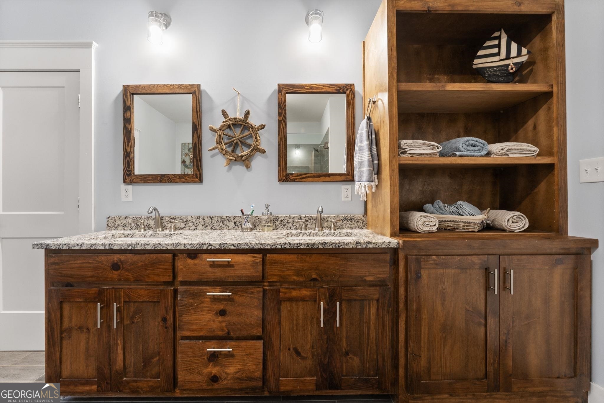 660 Doe Lane Mansfield, GA 30055 - Photo 13 of 45 a bathroom with a granite countertop sink and a mirror