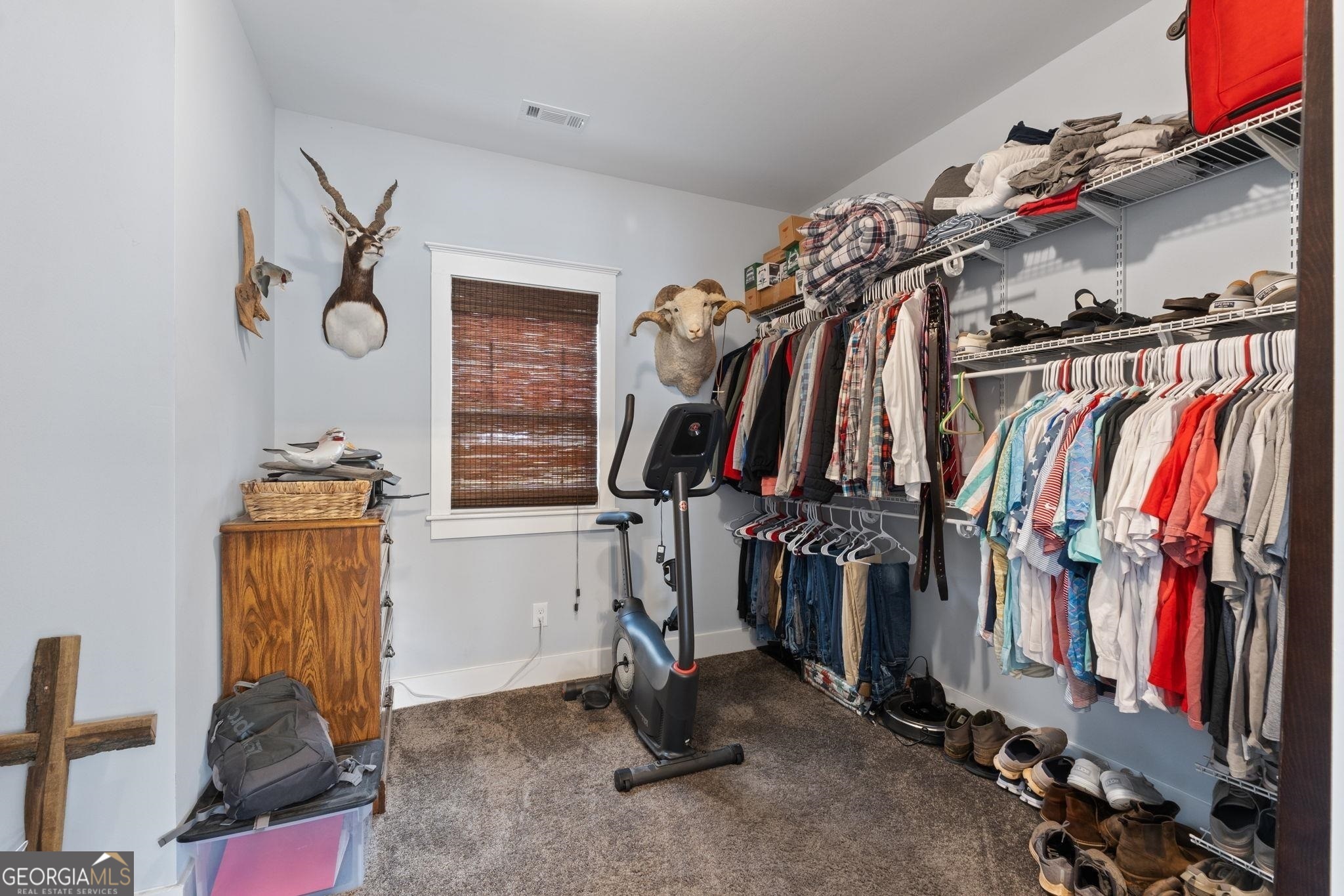660 Doe Lane Mansfield, GA 30055 - Photo 15 of 45 a view of walk in closet with clothes