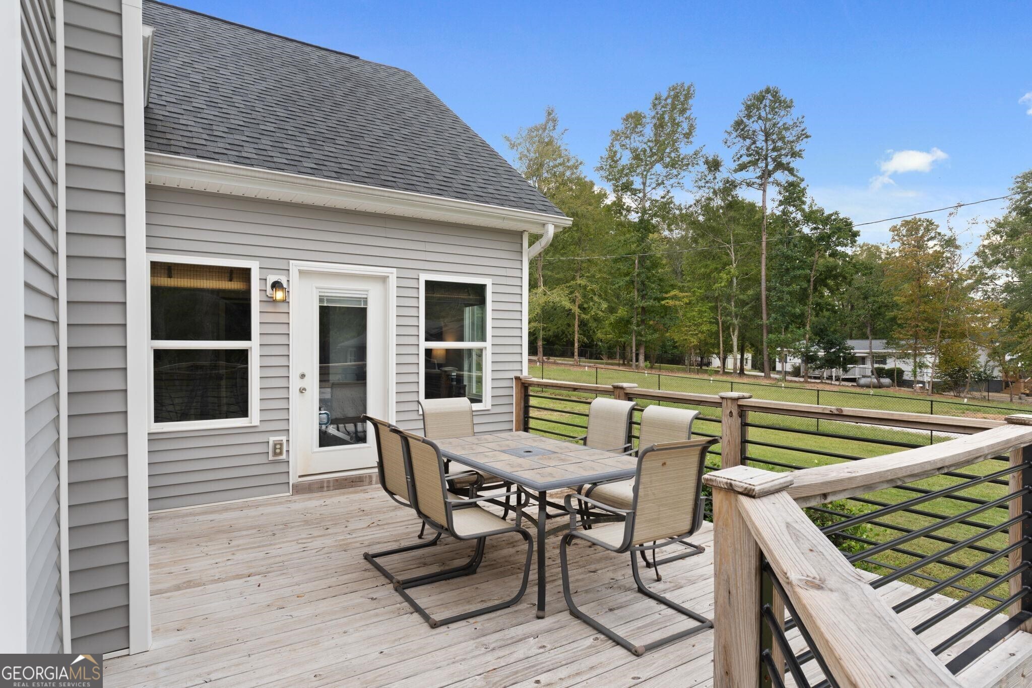 660 Doe Lane Mansfield, GA 30055 - Photo 20 of 45 a view of a house with backyard and sitting area