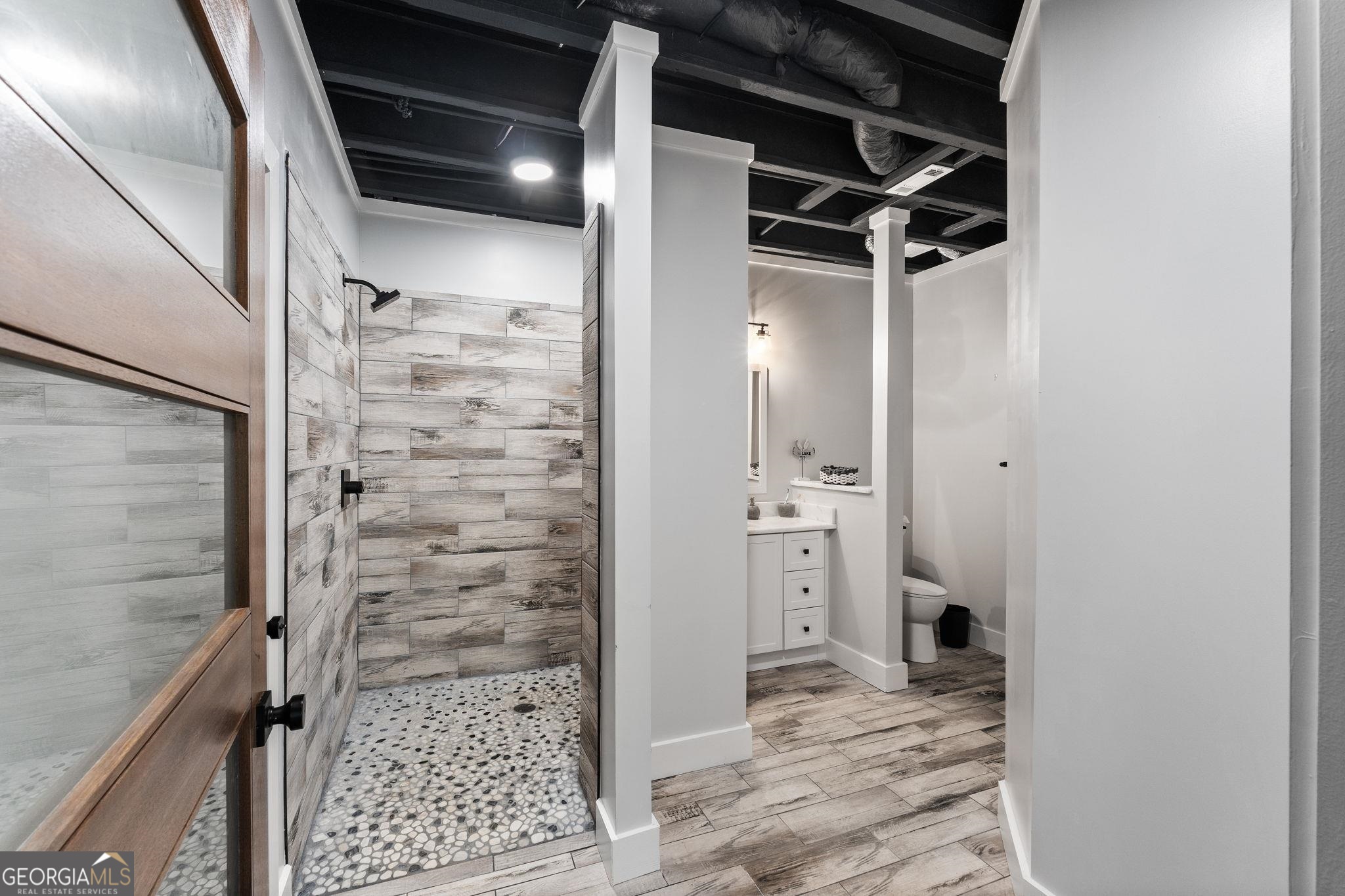 660 Doe Lane Mansfield, GA 30055 - Photo 27 of 45 a bathroom with a shower and a sink