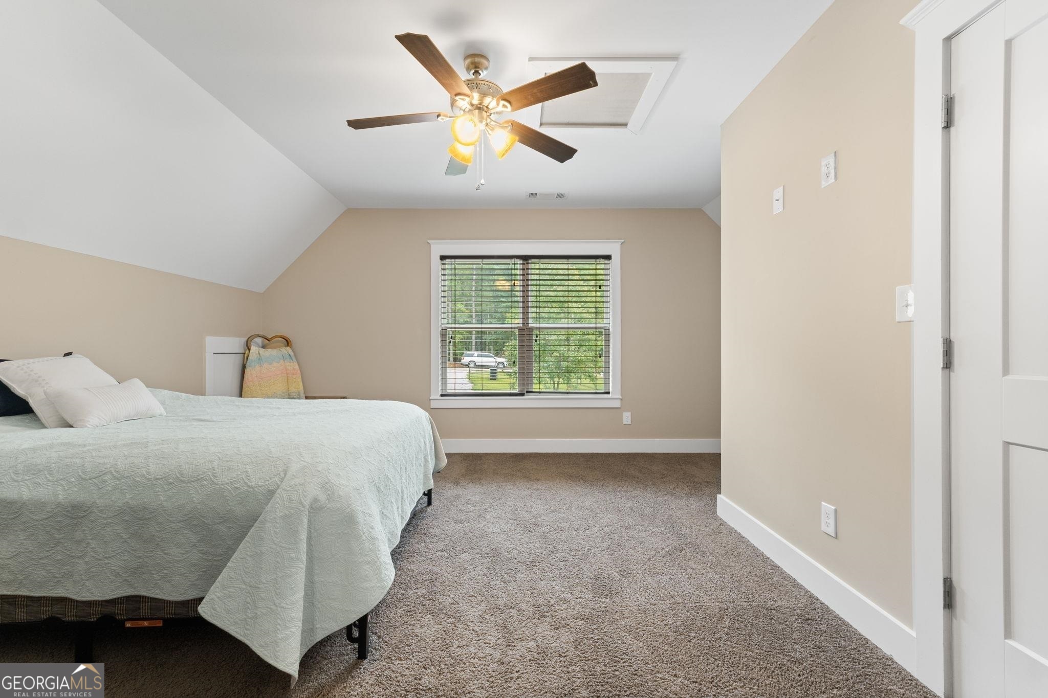 660 Doe Lane Mansfield, GA 30055 - Photo 28 of 45 a bedroom with a bed and a large window