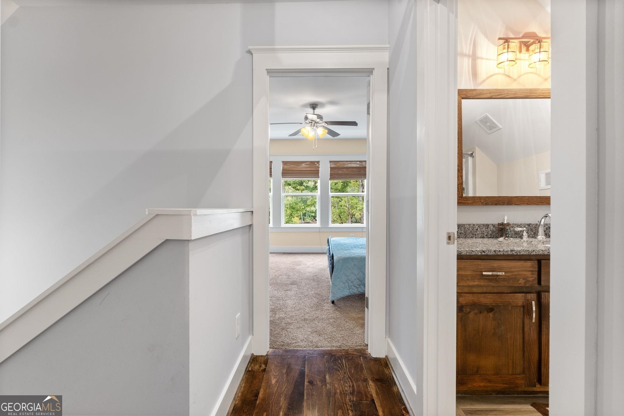 660 Doe Lane Mansfield, GA 30055 - Photo 30 of 45 a view of a hallway with wooden floor and a living room