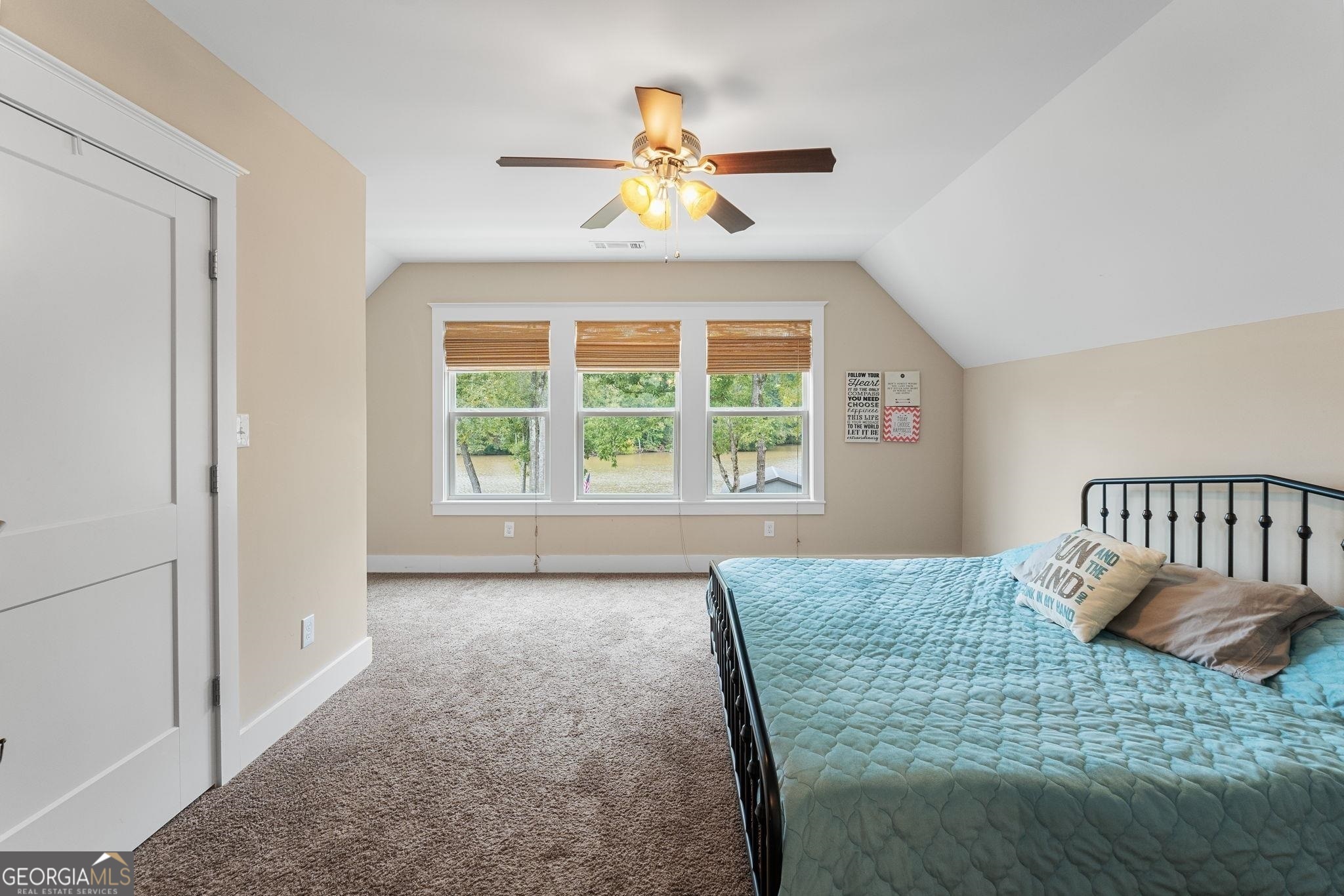 660 Doe Lane Mansfield, GA 30055 - Photo 31 of 45 a bedroom with a bed and a large window