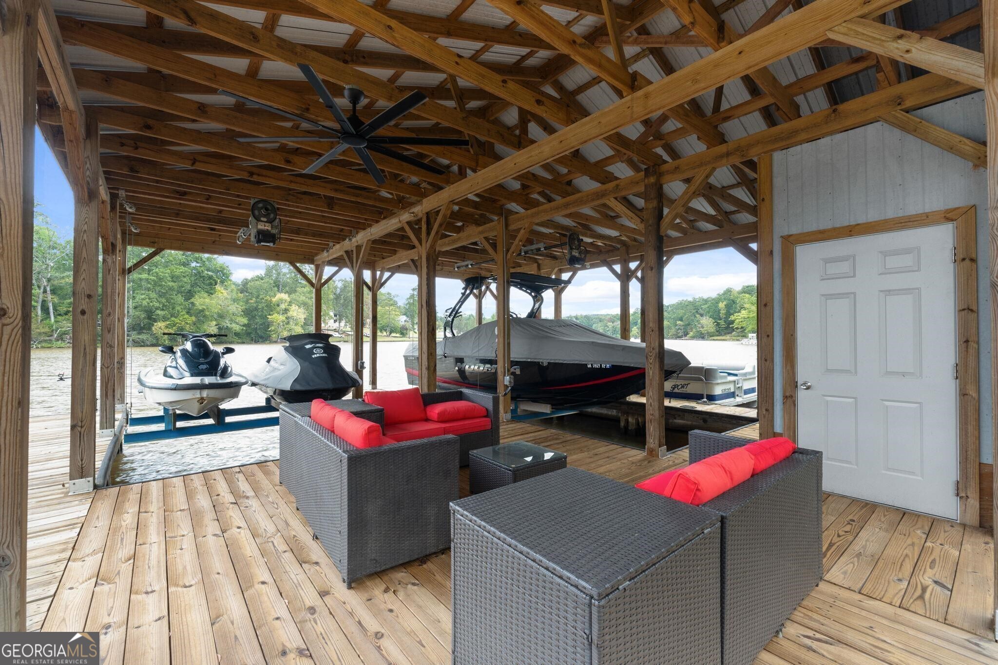 660 Doe Lane Mansfield, GA 30055 - Photo 38 of 45 a view of a deck with wooden floor and outdoor seating