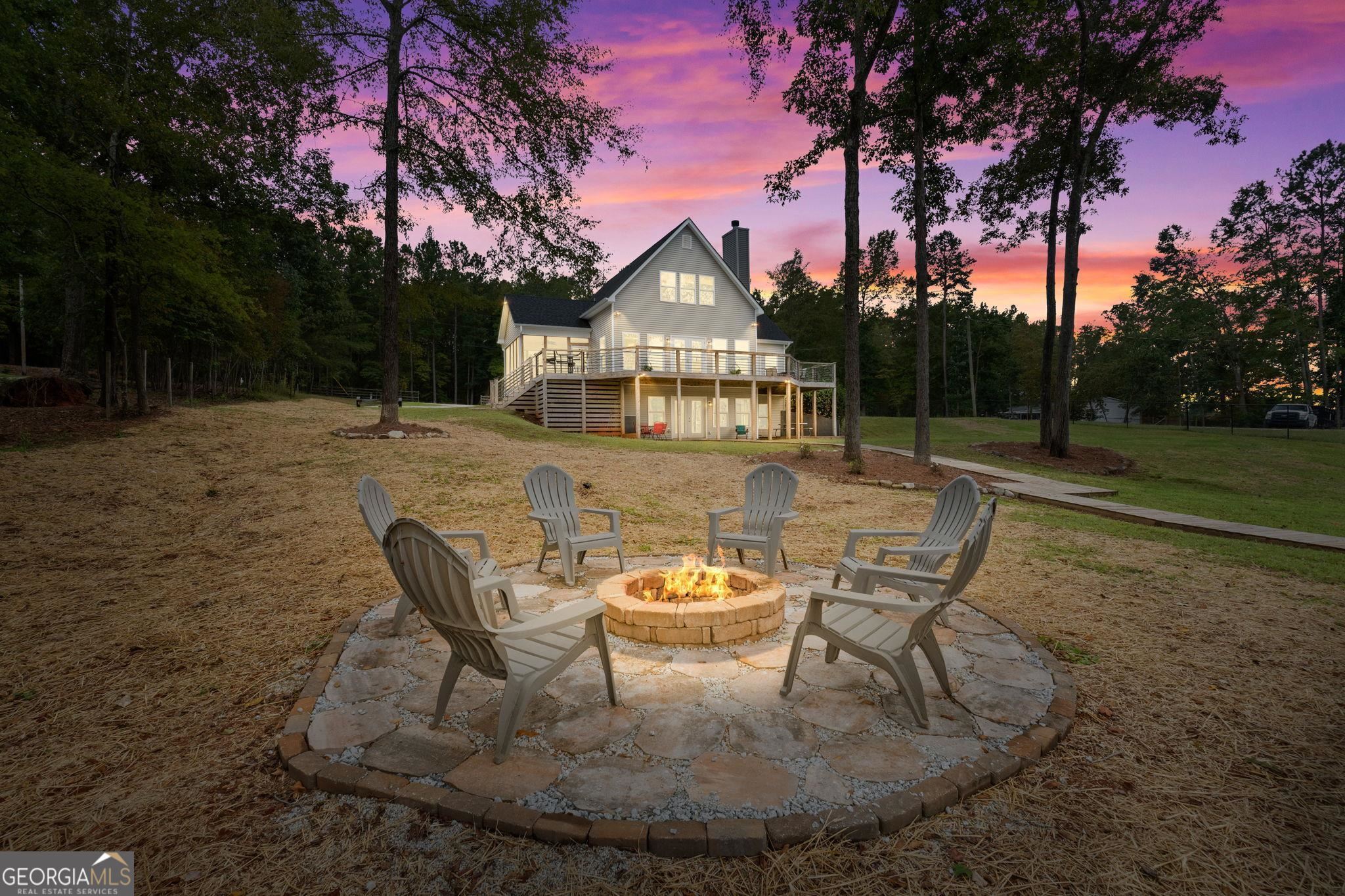 660 Doe Lane Mansfield, GA 30055 - Photo 4 of 45 a view of a chairs and tables in the patio