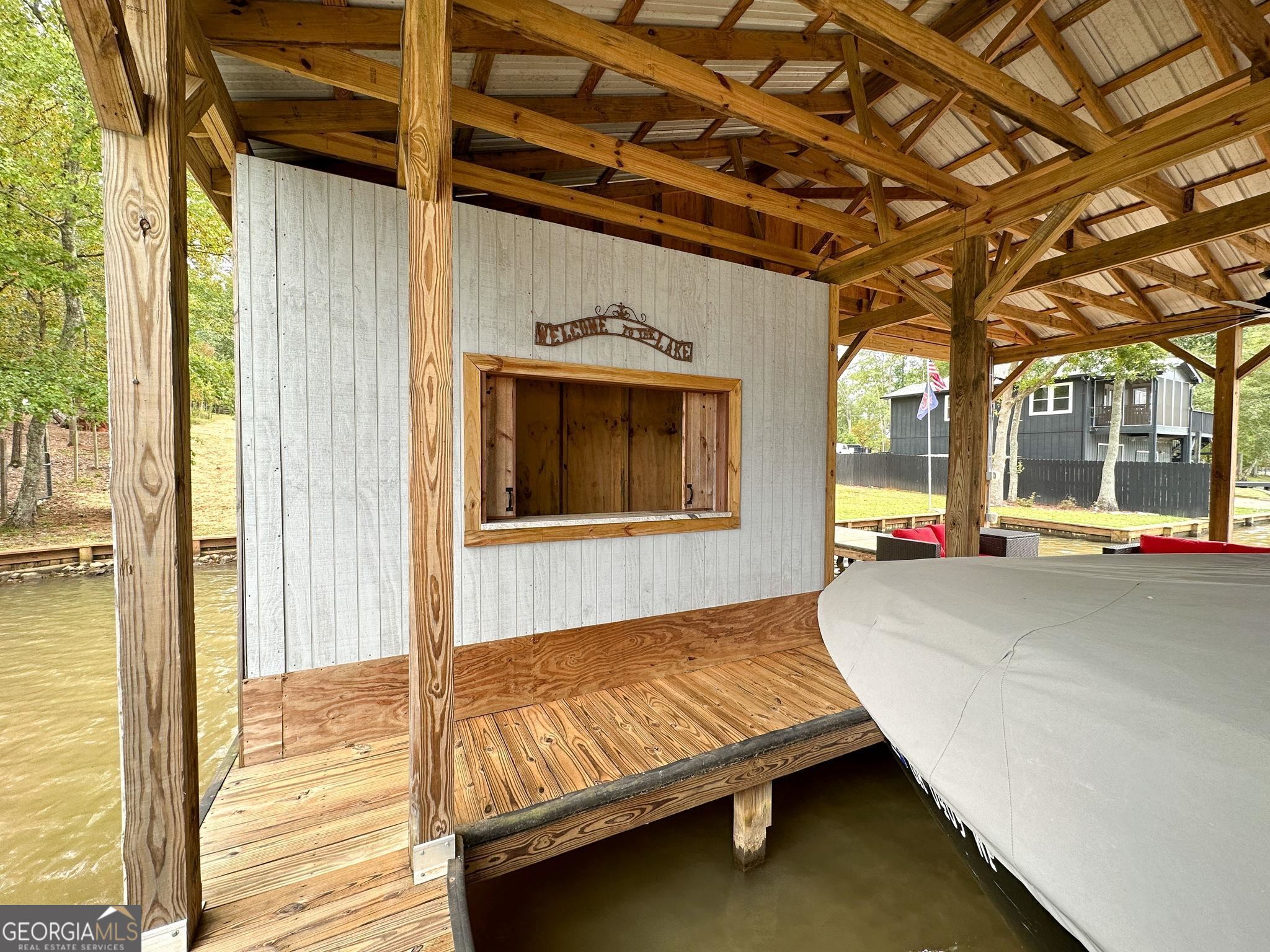 660 Doe Lane Mansfield, GA 30055 - Photo 41 of 45 a spacious bedroom with a bed and wooden floor