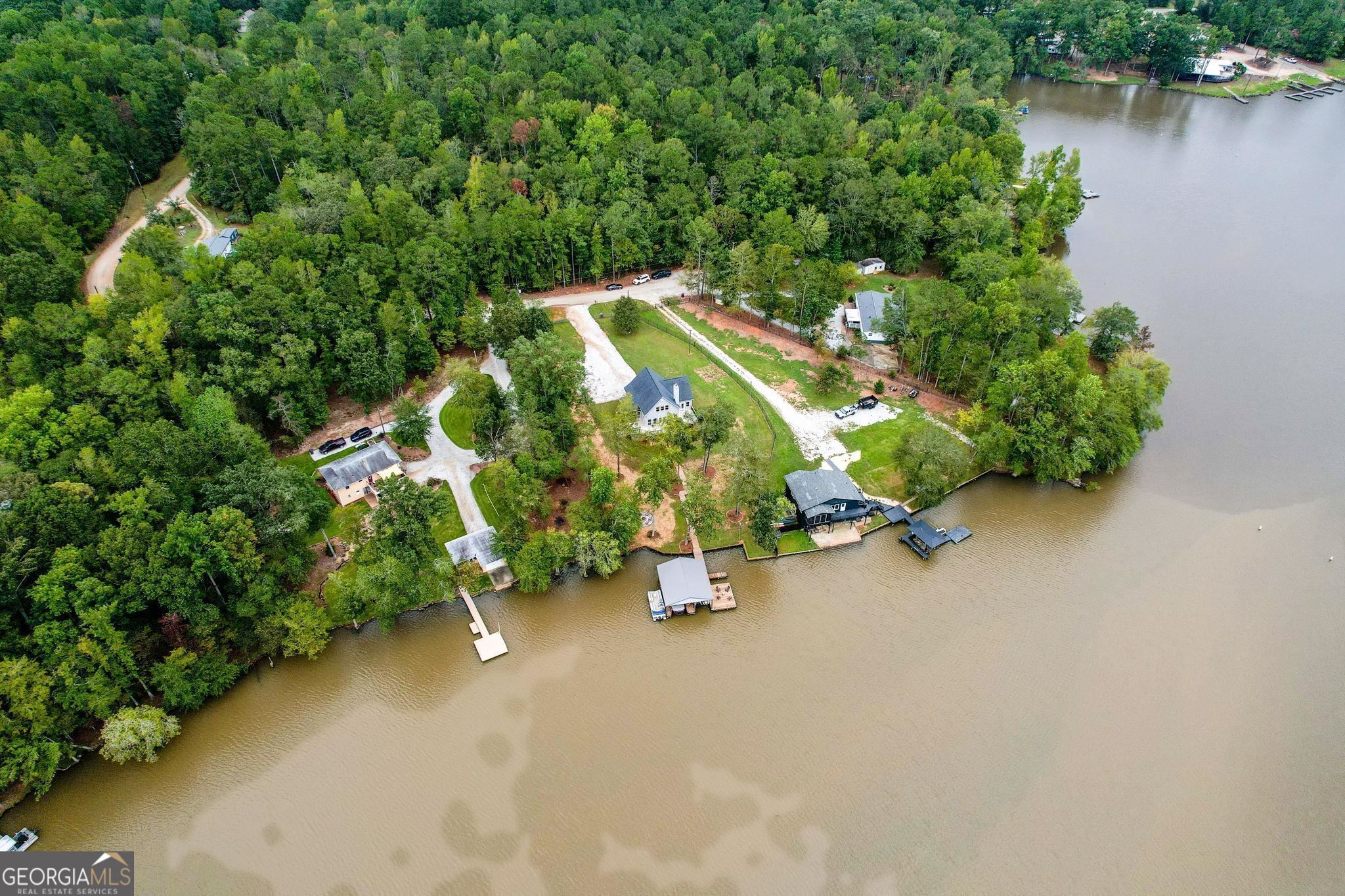 660 Doe Lane Mansfield, GA 30055 - Photo 44 of 45 an aerial view of a house with outdoor space and lake view