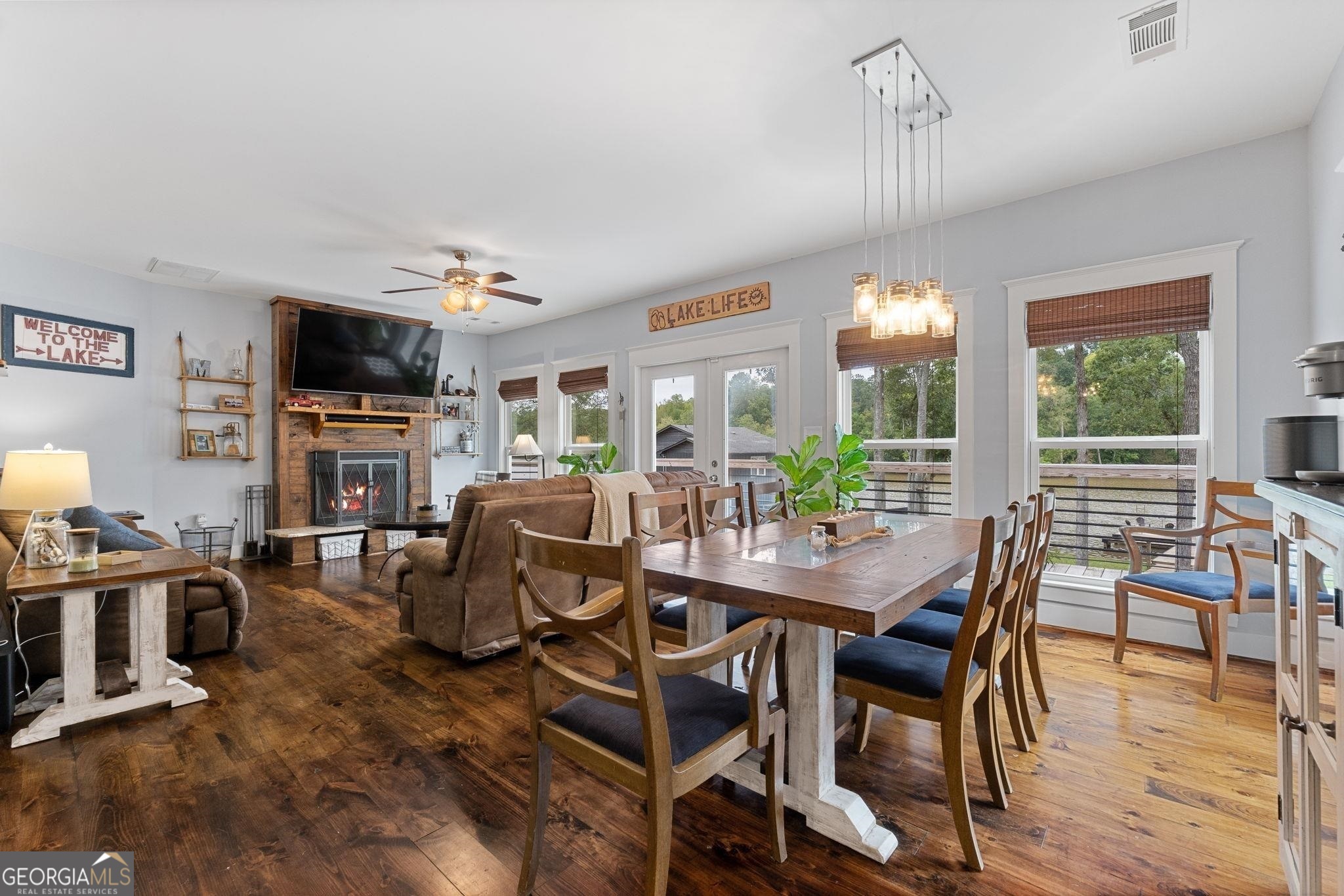660 Doe Lane Mansfield, GA 30055 - Photo 7 of 45 a view of a dining room with furniture window and wooden floor