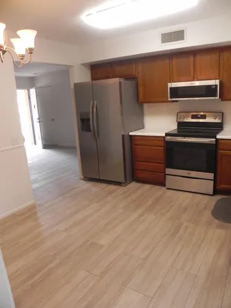 a view of a house with garden and sitting area