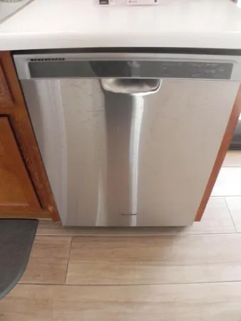 a view of a house with a small yard and plants