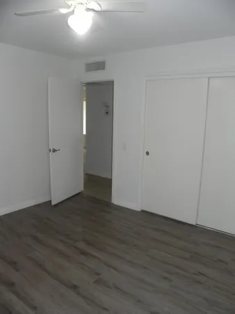a bathroom with a toilet and a shower curtain