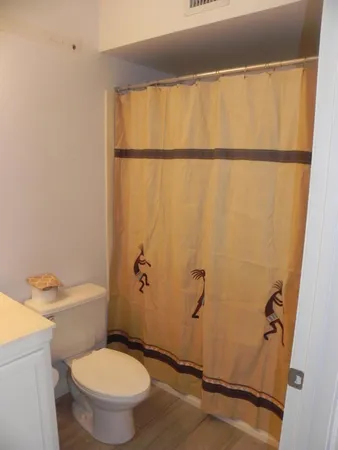 a kitchen with stainless steel appliances granite countertop a stove a refrigerator and a sink