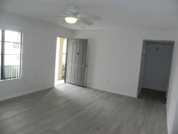 a view of a house with backyard porch and sitting area