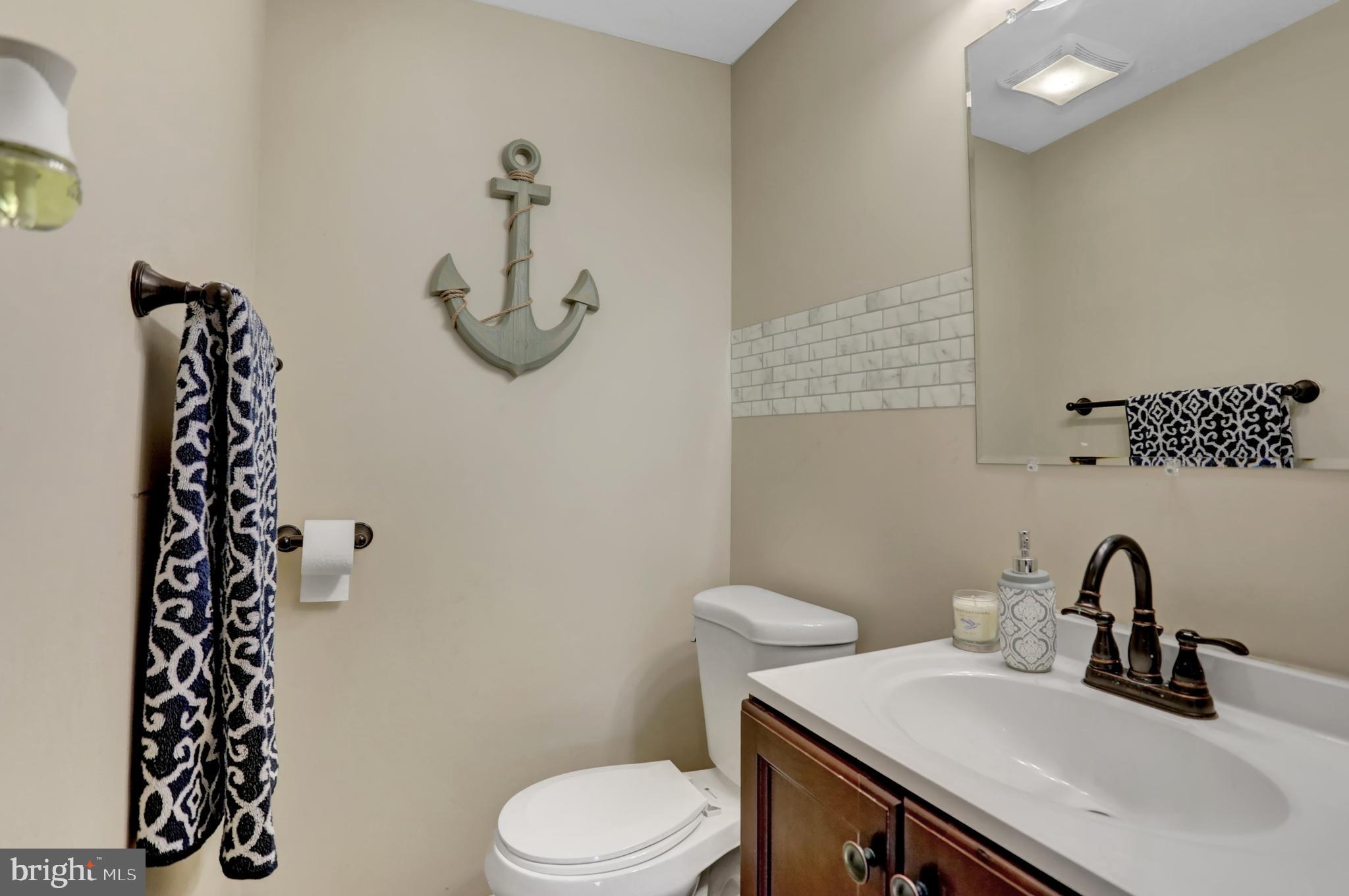 59 South Main Street Spring Grove, PA 17362 - Photo 18 of 50 a bathroom with a sink a toilet and mirror