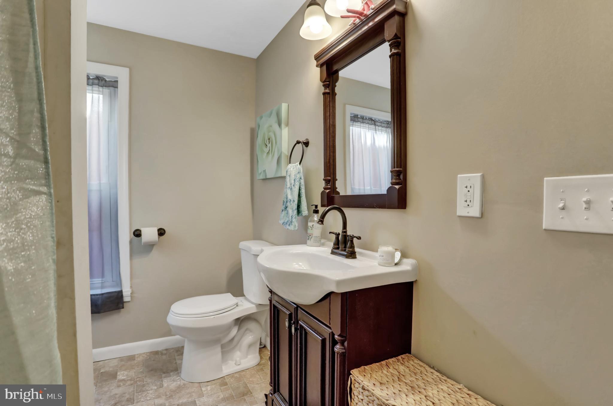 59 South Main Street Spring Grove, PA 17362 - Photo 24 of 50 a bathroom with a sink toilet and mirror