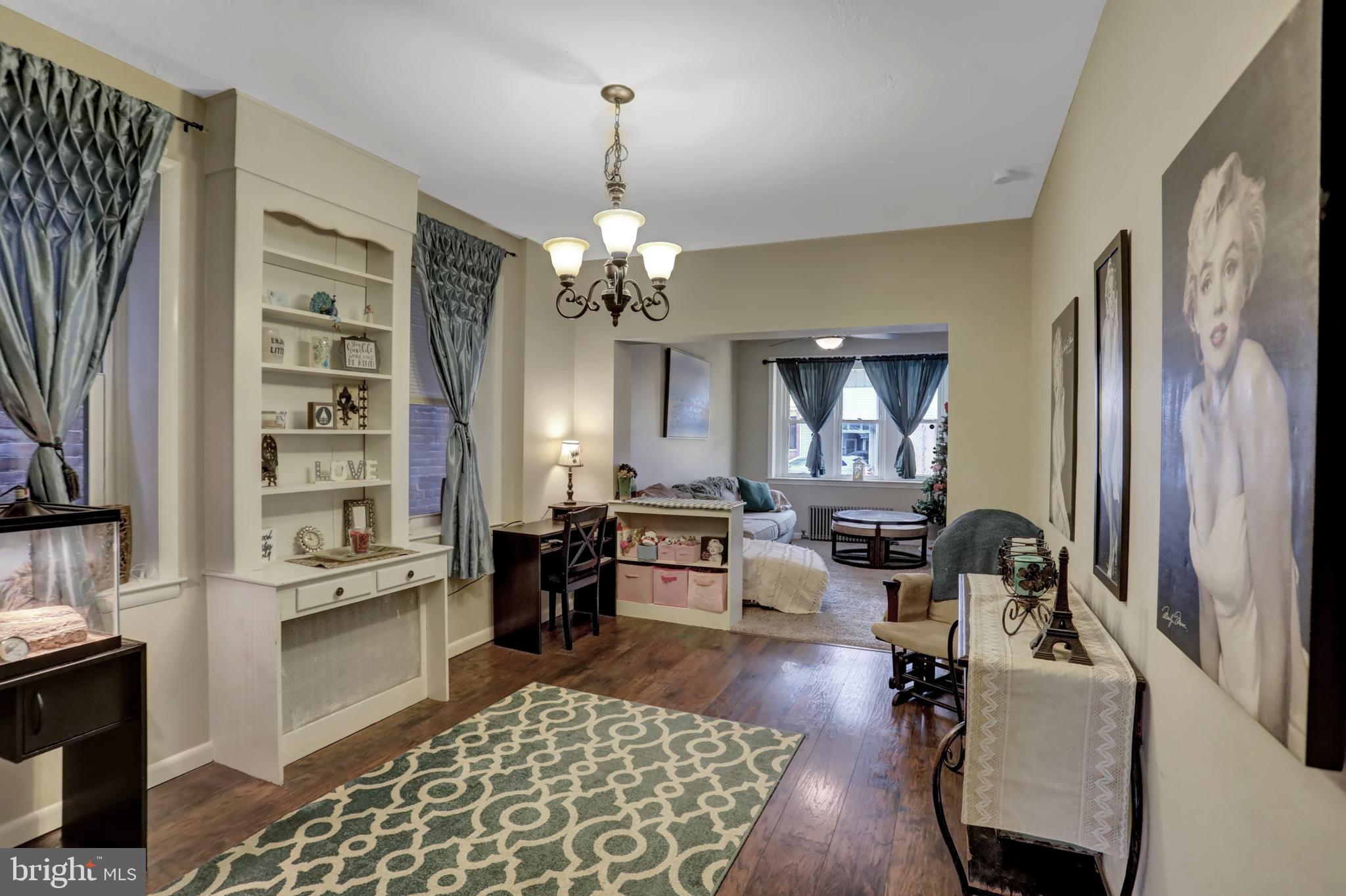 59 South Main Street Spring Grove, PA 17362 - Photo 10 of 50 a living room with furniture and a chandelier