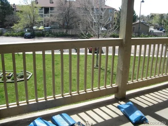 a view of a balcony with wooden floor