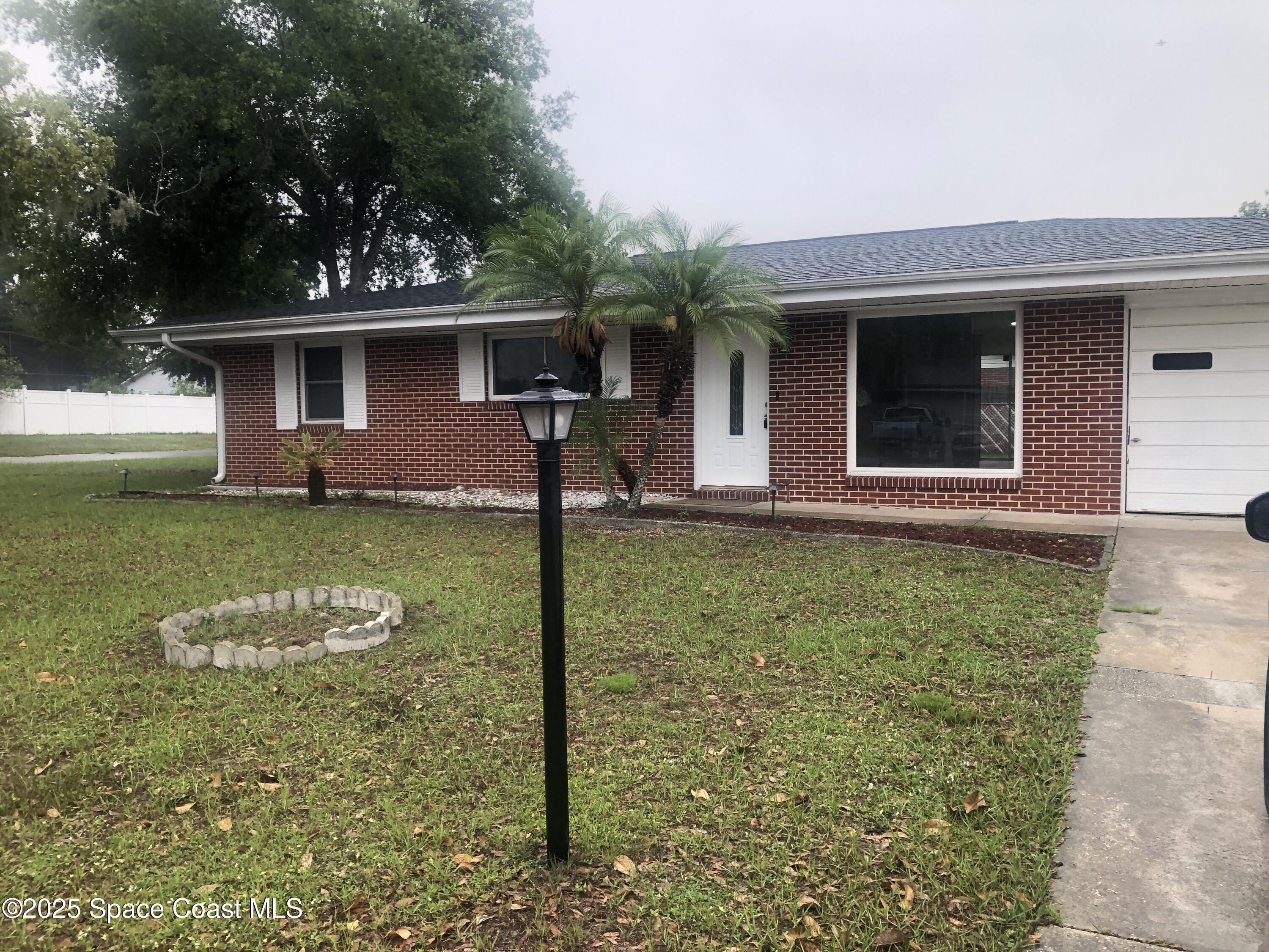 7703 Puritan Road Orlando, FL 32807 - Photo 1 of 12 Front