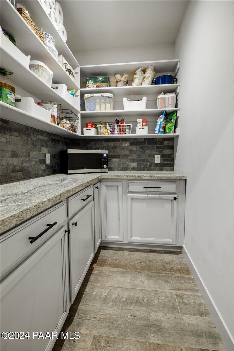 1947 Shadow Valley Drive Prescott, AZ 86305 - Photo 19 of 54 a kitchen with stainless steel appliances granite countertop a sink and cabinets