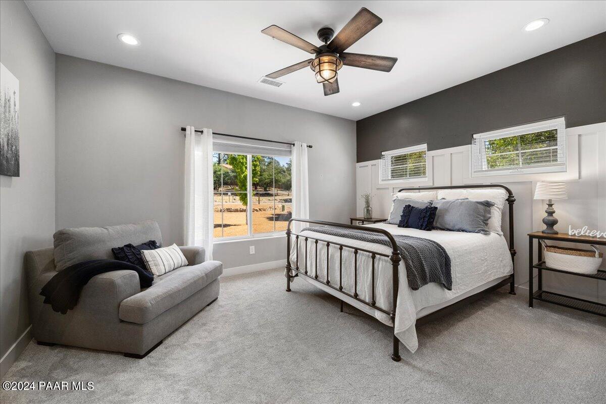 1947 Shadow Valley Drive Prescott, AZ 86305 - Photo 28 of 54 a spacious bedroom with a bed couch and window