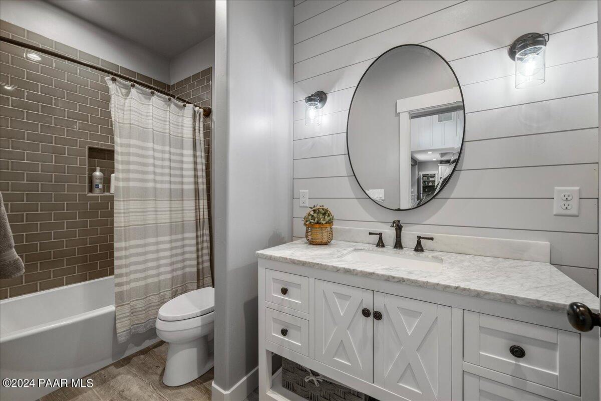 1947 Shadow Valley Drive Prescott, AZ 86305 - Photo 30 of 54 a bathroom with a sink a toilet and a mirror