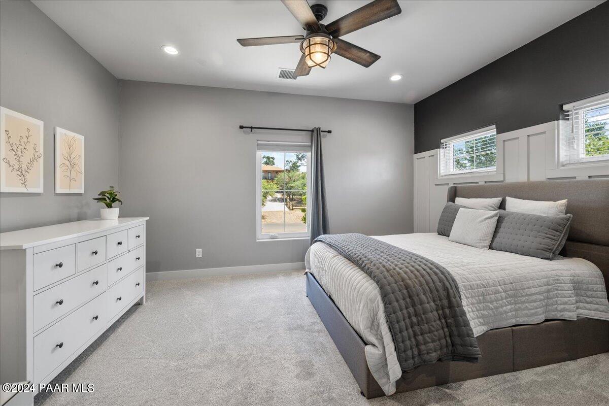 1947 Shadow Valley Drive Prescott, AZ 86305 - Photo 31 of 54 a bedroom with a bed a window and flowerpot