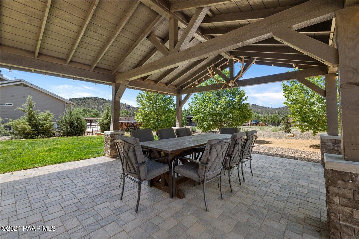 1947 Shadow Valley Drive Prescott, AZ 86305 - Photo 41 of 54 a view of a patio with a table chairs and a backyard