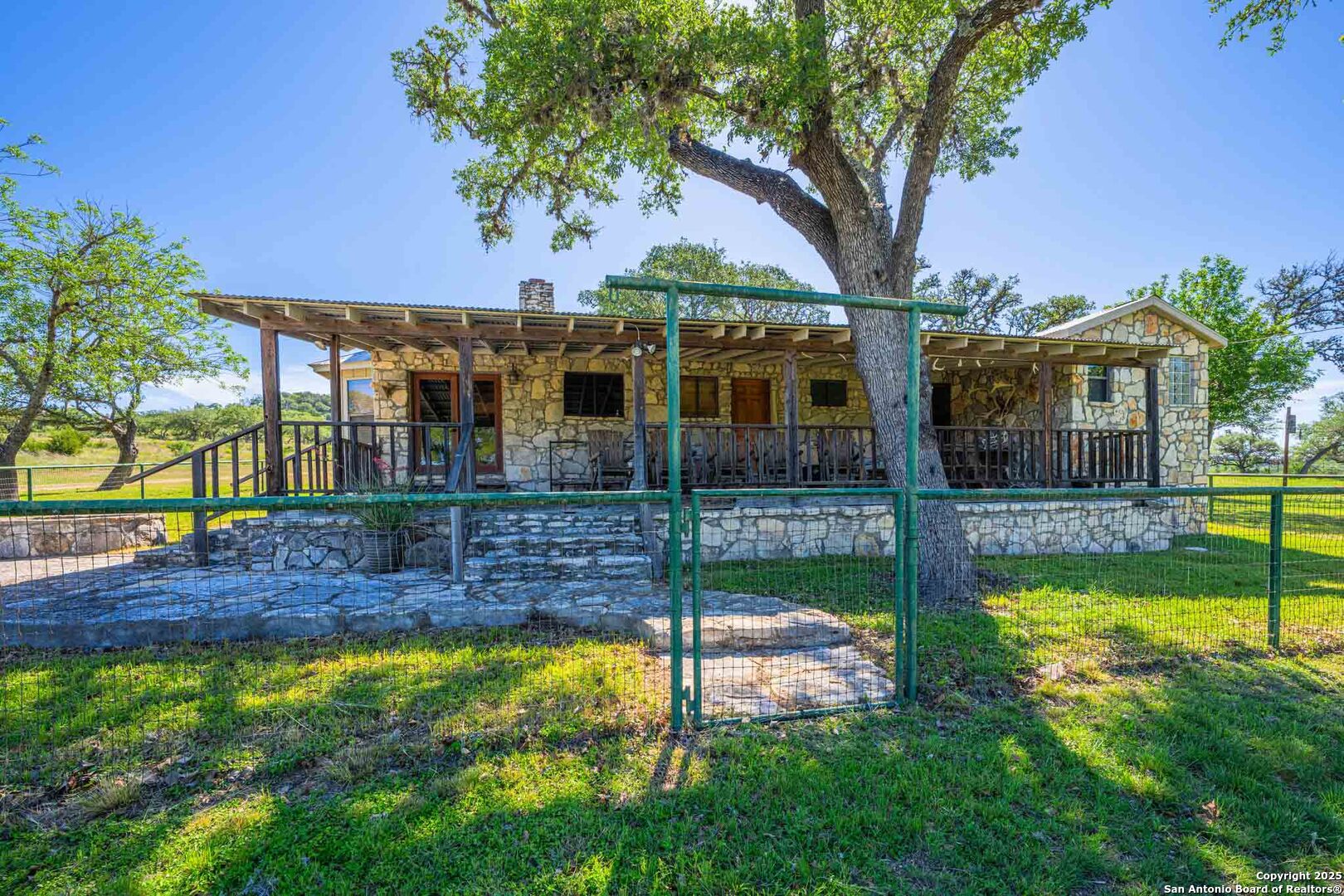 165 Flach Road Comfort, TX 78013 - Photo 28 of 69 a view of a house with a yard