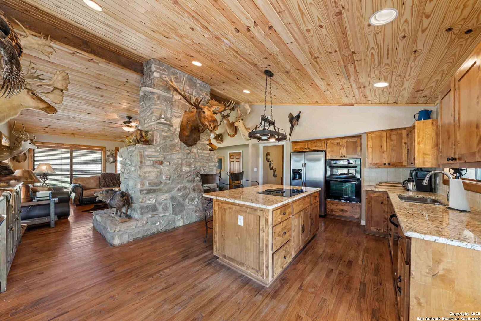 165 Flach Road Comfort, TX 78013 - Photo 33 of 69 a kitchen with stove and wooden floor