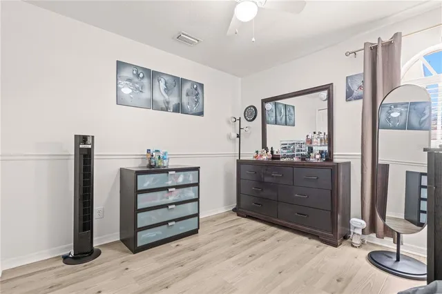 a room with a dresser and a mirror