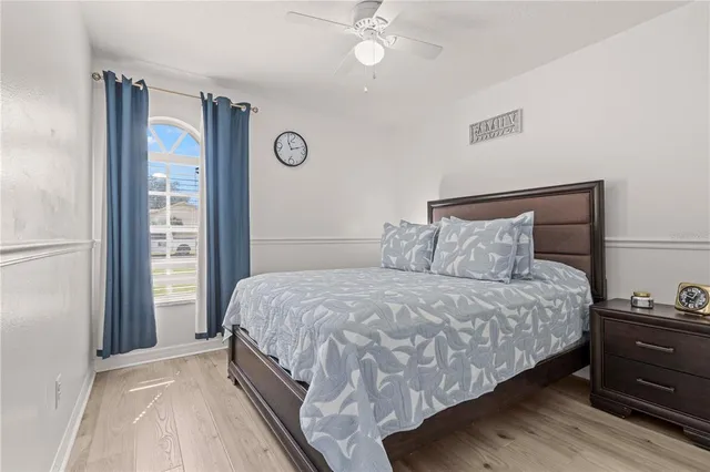 a bedroom with a bed and window