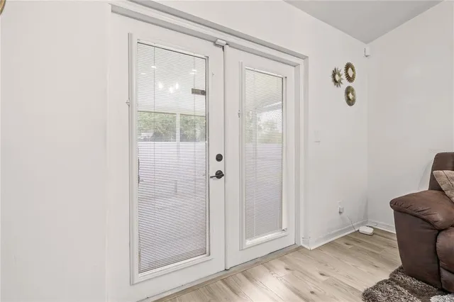 a bathroom with a glass shower door