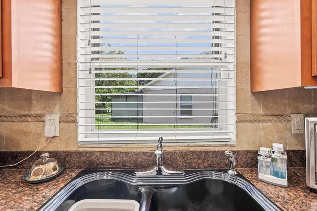 a kitchen with a sink and a window