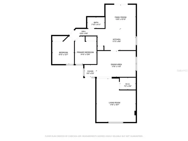 a picture of a bench in front of a wall