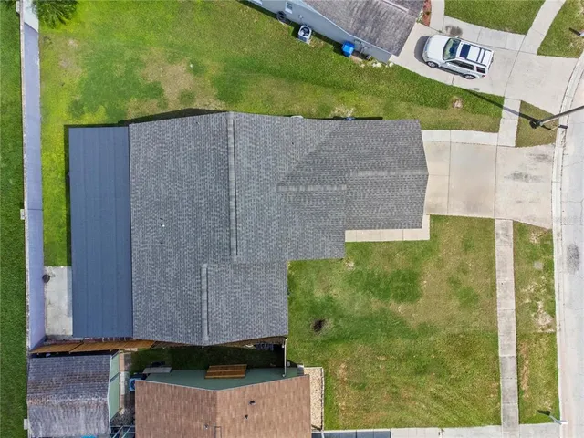 an aerial view of a house with a garden