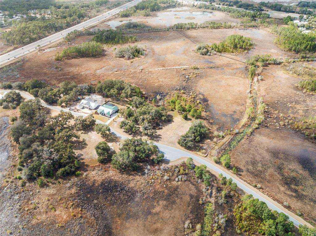 446 Long And Winding Road Howey-in-the-Hills, FL 34737 - Photo 12 of 32 a view of a yard with a pathway