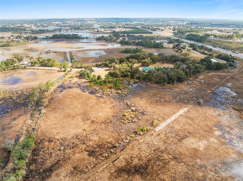446 Long And Winding Road Howey-in-the-Hills, FL 34737 - Photo 15 of 32 an aerial view of ocean and residential houses with outdoor space