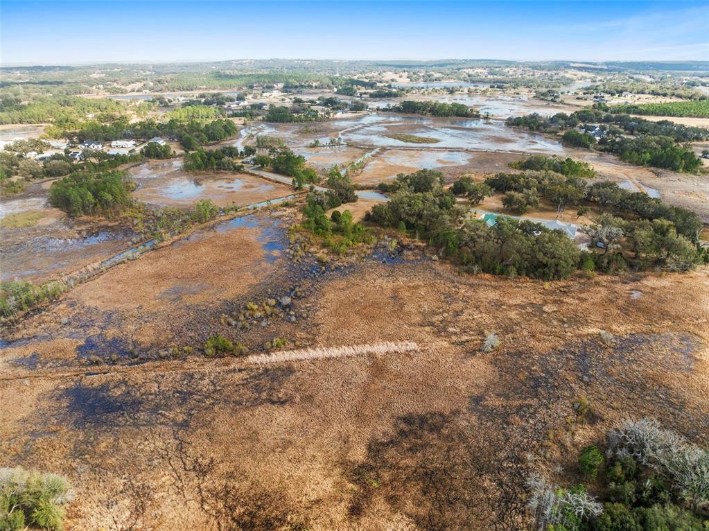 446 Long And Winding Road Howey-in-the-Hills, FL 34737 - Photo 16 of 32 a view of city and ocean
