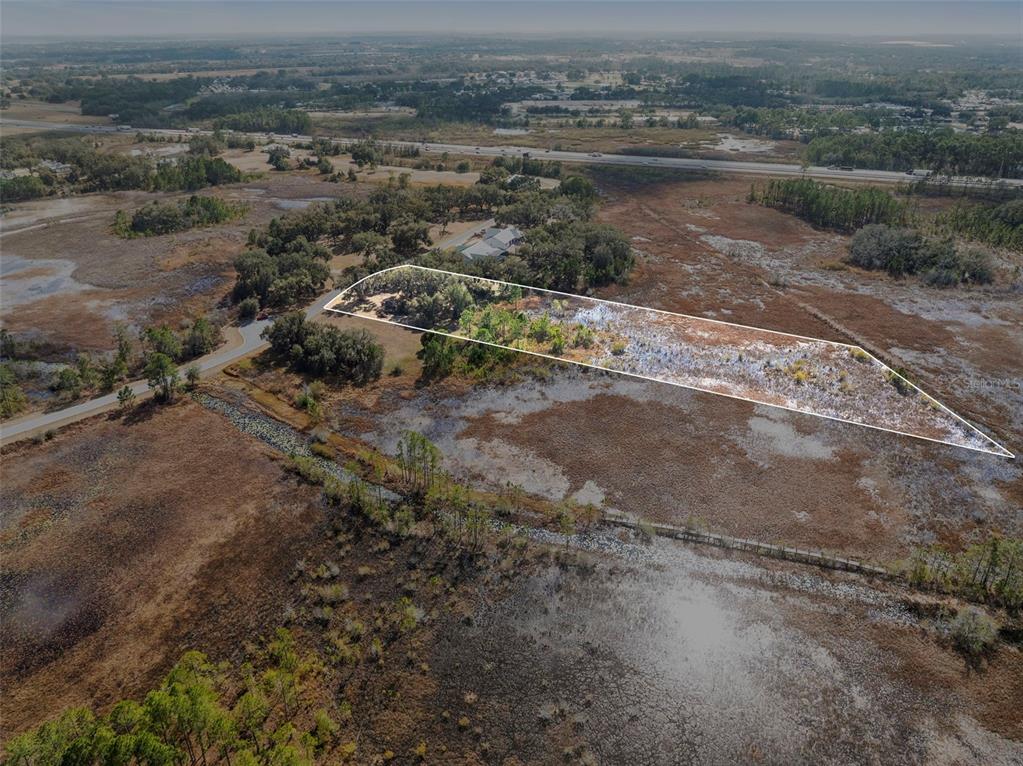 446 Long And Winding Road Howey-in-the-Hills, FL 34737 - Photo 4 of 32 an aerial view of mountains with green space