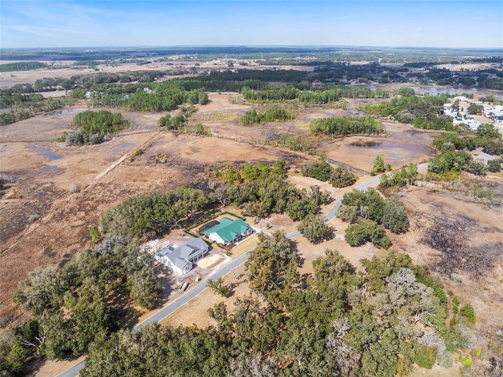 446 Long And Winding Road Howey-in-the-Hills, FL 34737 - Photo 8 of 32 an aerial view of beach and city